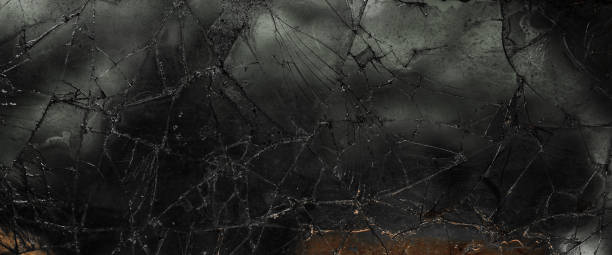 istock Pattern on cracked window glass. damage to glass. cracked texture. broken window 2171445391