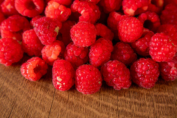 Various raspberries on the table. Raspberry fruits are edible, which have both sweet and sour tastes. They are also high in vitamin C and are beneficial to the body.