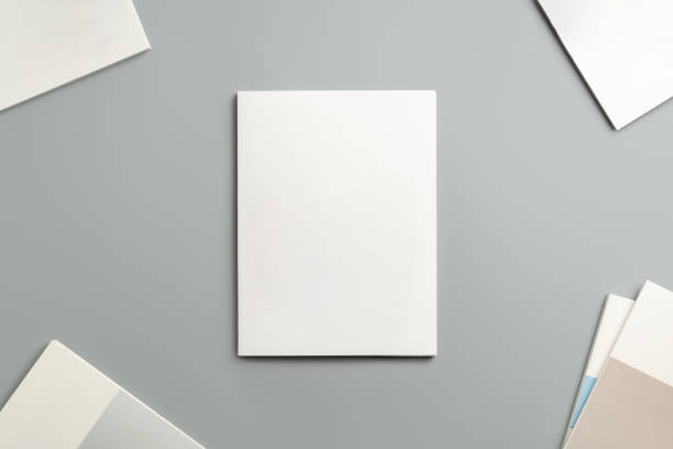 istock Empty White Sheet of Paper Positioned at an Angle on Light Gray Surface 2171448645