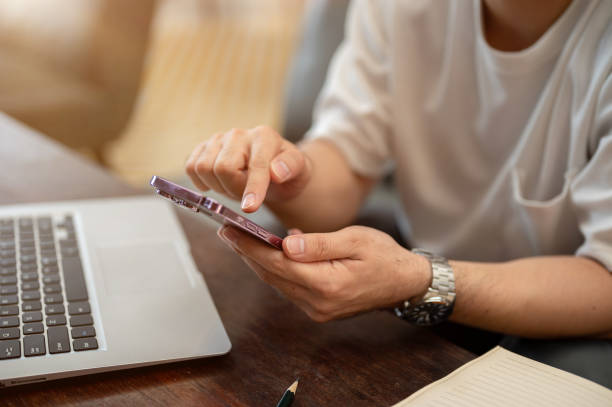 istock A cropped image of a man using his smartphone while sitting in a coffee shop. 2171449145