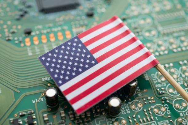 istock US America flag on green circuit board background. 2171450324
