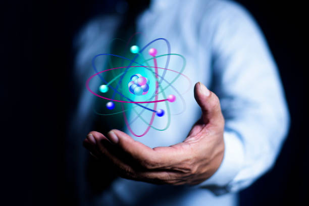 istock Bussinessman hand holding creative atom. Nuclear fusion concept, endless energy, cheap electricity, future technologies. Science and future concept 2171450959