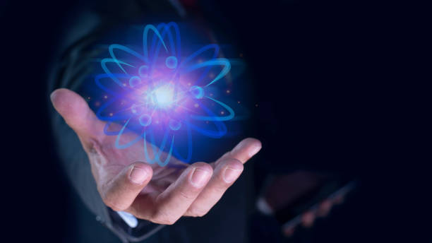 istock Bussinessman hand holding creative atom. Nuclear fusion concept, endless energy, cheap electricity, future technologies. Science and future concept 2171450960