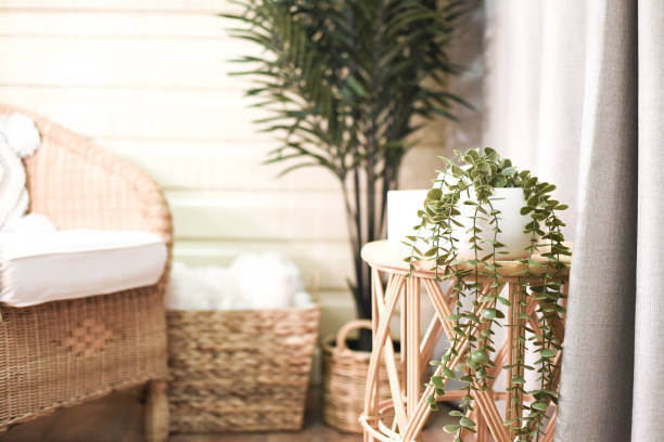 istock Wicker Chairs sitting room with blanket and side table 2171451154