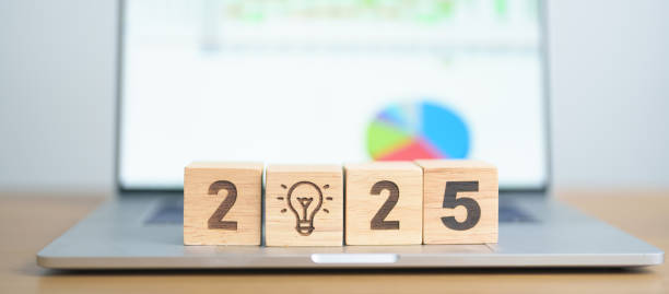 istock 2025 Year block with lightbulb icon against computer laptop background. Business Idea, Creative, Thinking, brainstorm, Goal, Resolution, strategy, plan, Action, change and New Year start concepts 2171454842