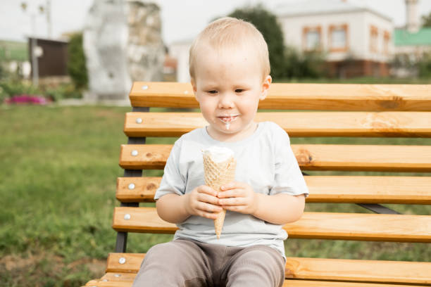 Cute Toddler Boy enjoy eating his ice cream
