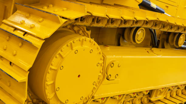 istock Modern bulldozer tracks and drive gear. Large yellow construction machine. Heavy industry equipment. Equipment for road and construction works 2171456057