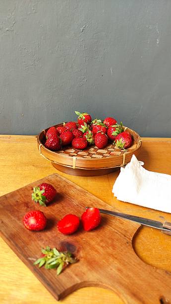istock Fresh red strawberries on a wooden table 2171457223