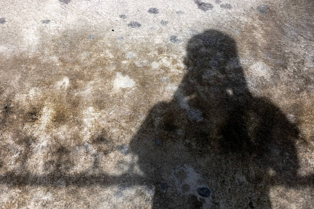 istock Shadow Of A Photographer On Cement Floor 2171457838