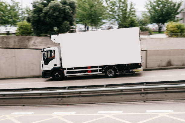 istock Small refrigerated truck in a city 2171463817