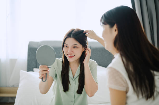 istock Asian Chinese woman combing hair. 2171464103