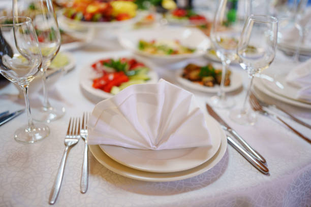 istock A beautifully folded napkin on a plate of a served table. 2171467882