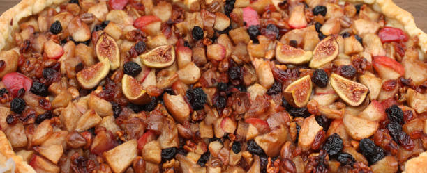 istock Mixed fruit tart Fig, walnuts, apple and raisins 2171468380
