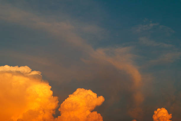 istock Orange cloud formations abstract nature background. Sky at sunset, orange cumulus clouds. Pink and red colored evening sky. 2171468901