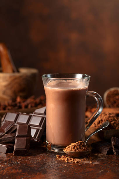istock Glass of cocoa drink with ingredients on a brown table. 2171473003