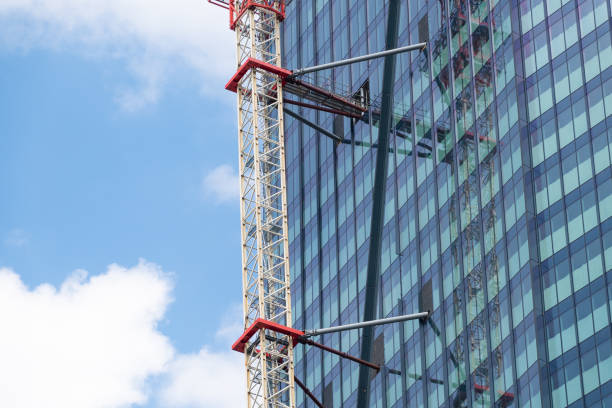 Construction crane attached to a high-rise building. Skyscraper construction.