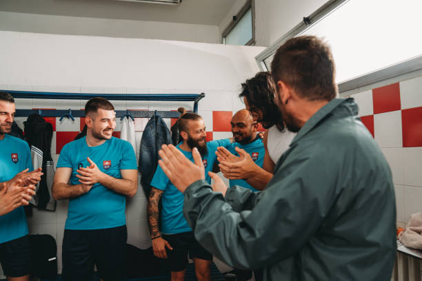 istock Team players are clapping their hands to the captain 2171479058