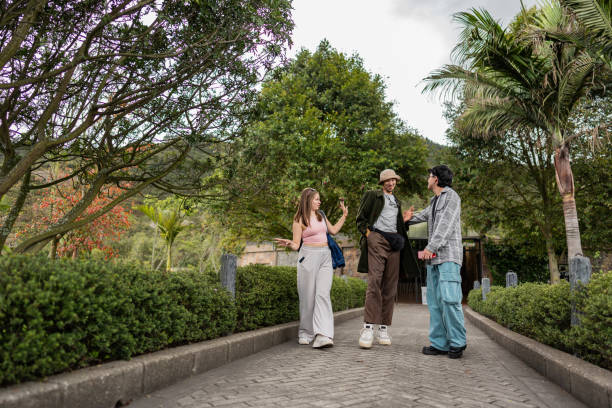 istock Friends talking and walking around the park 2171479236