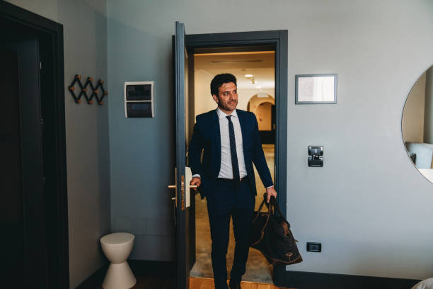 istock A businessman is entering in an hotel room 2171479697