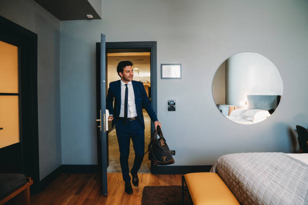 istock A businessman is entering in an hotel room 2171479708