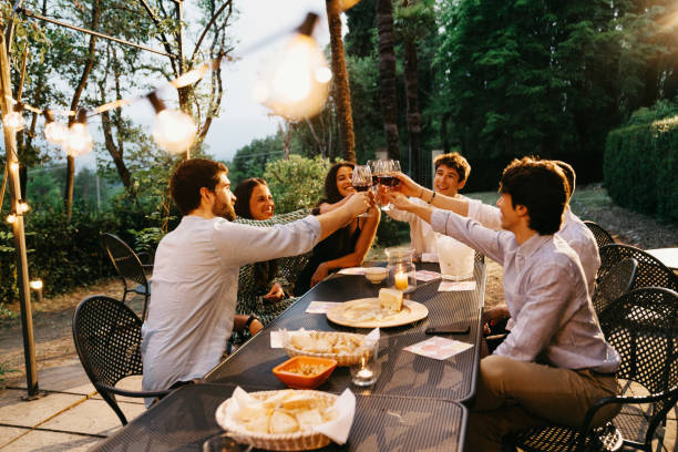 istock Friends toasting together at dinner 2171480148