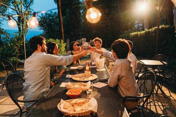 istock Friends toasting together at dinner 2171480151