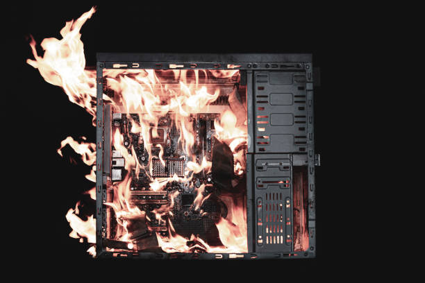 istock a burning system unit from a computer from a short circuit and a power surge on a black isolated background 2171481911