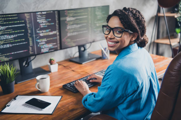istock Photo of lovely young lady typing keyboard coding developer dressed blue shirt comfortable programmer startup office loft room interior 2171487551