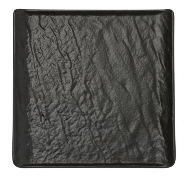 istock Empty black square board for serving food on a white isolated background 2171489471
