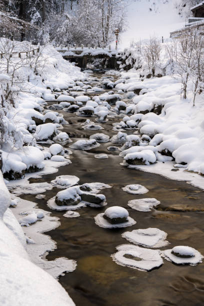 istock River during winter in the French Alps. 2171489775