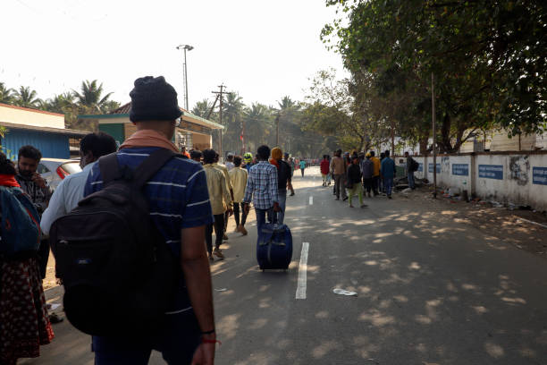 Coimbatore, Tamil Nadu, India – February 18, 2023: Travelers walking on road.