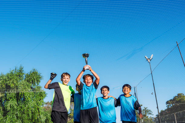istock Kids Celebrating on Soccer Field 2171492625