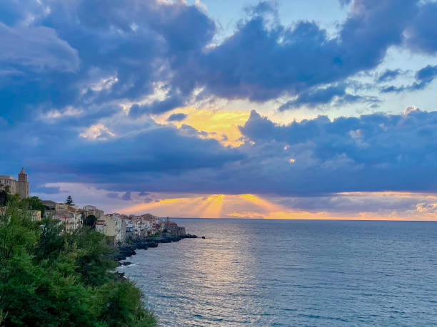istock Sun Rays Through Clouds: Summer Sunset Over The Sea in Cefalu, Sicily 2171493130