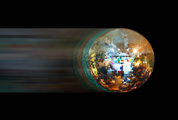 Party disco mirror ball reflecting orange and green lights