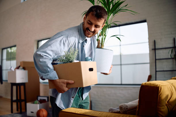 istock Happy man moving into new home. 2171500824