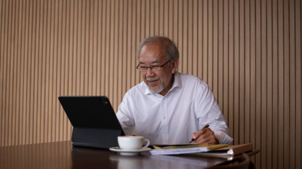 istock Businessman working in a modern office working business on laptop computer and document  collaborating on a project a coffee cup on the table. 2171500924