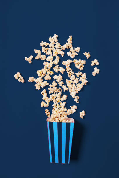 istock popcorn on classic blue color background top view 2171502002