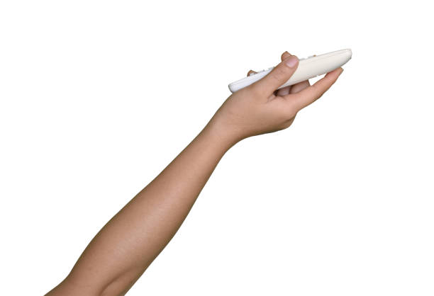Hand holding air conditioner remote control isolated on white background, clipping path
