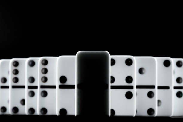 istock Domino pieces put in a row on black background 2171503163