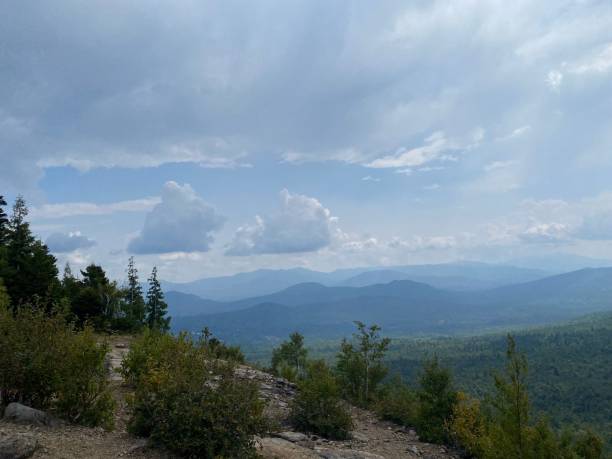 istock Scenic mountainous landscape with lush greenery and clouds. 2171503662