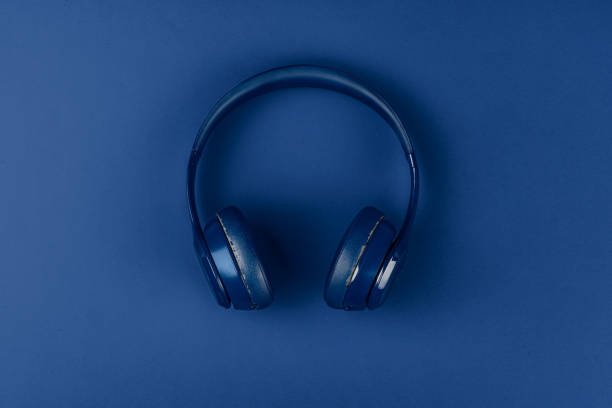 istock Blue headphones on blue background, top view 2171508433
