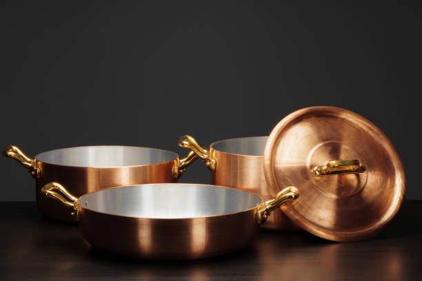 istock Shiny vintage copper cookware over dark background 2171508862