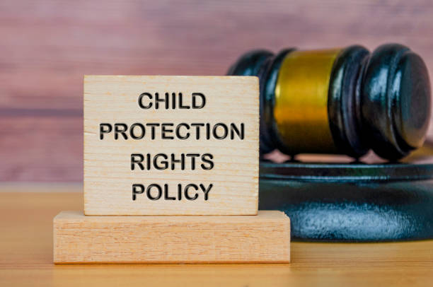 istock Child Protection Rights Policy text engraved on wooden blocks with gavel background 2171509436