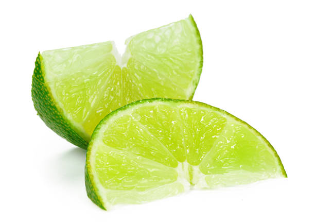 istock Pieces of lime isolated on white background 2171517331