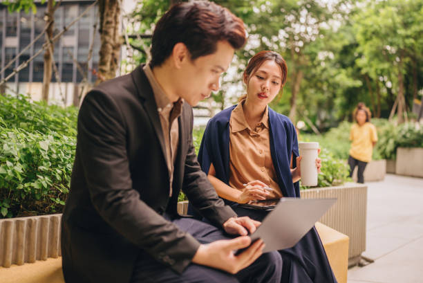 istock Confident businesswomen meet in a public space using tablets and laptops to present a new project together. 2171519323