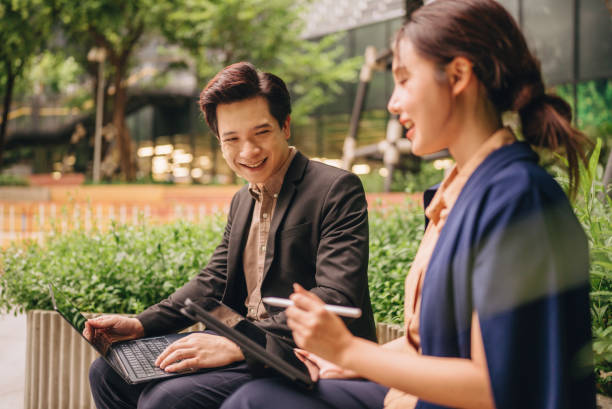 istock Confident businesswomen meet in a public space using tablets and laptops to present a new project together. 2171519325