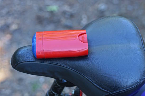 istock one  open big red blue dry deodorant lies on a black leather bicycle saddle 2171520318
