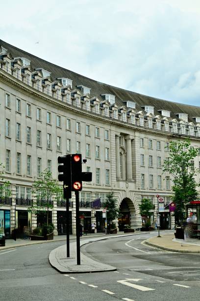 istock Urban street scene with curved building and traffic light 2171522721