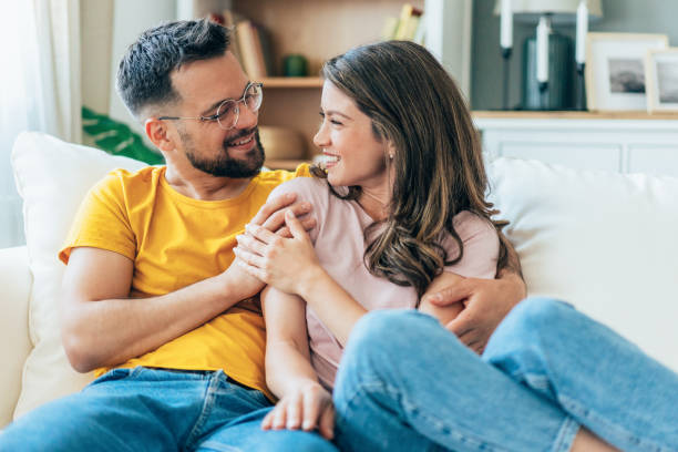istock Happy couple having romantic moment on couch 2171523647