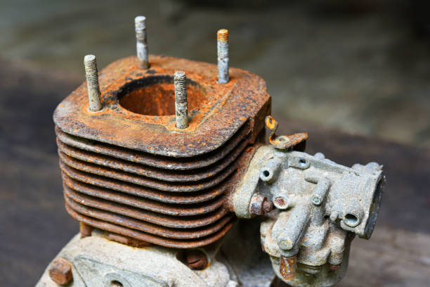 Old rusty cylinder of a small two-stroke engine .